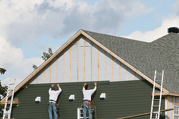 Professional Storm Damage Siding Repair technician working in Burnsville, NC